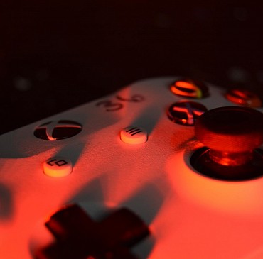 Xbox Controller with red lighting at Game On